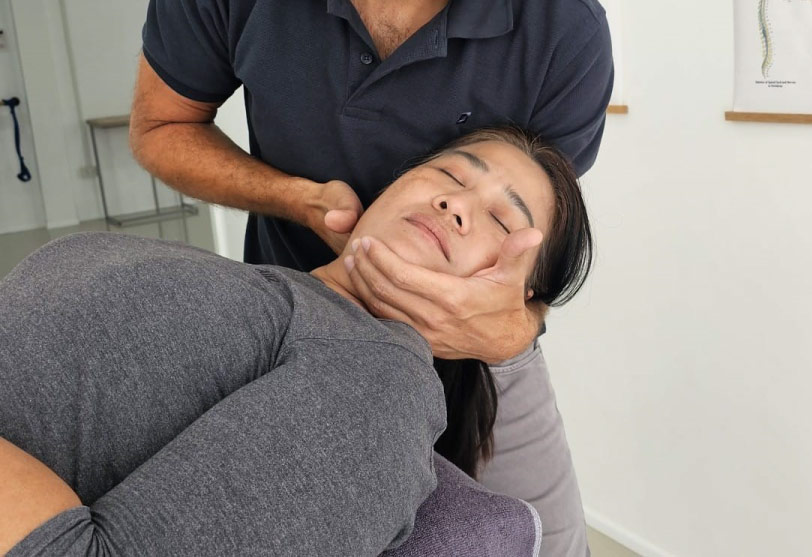 Physiotherapist applying manual therapy to the cervical spine